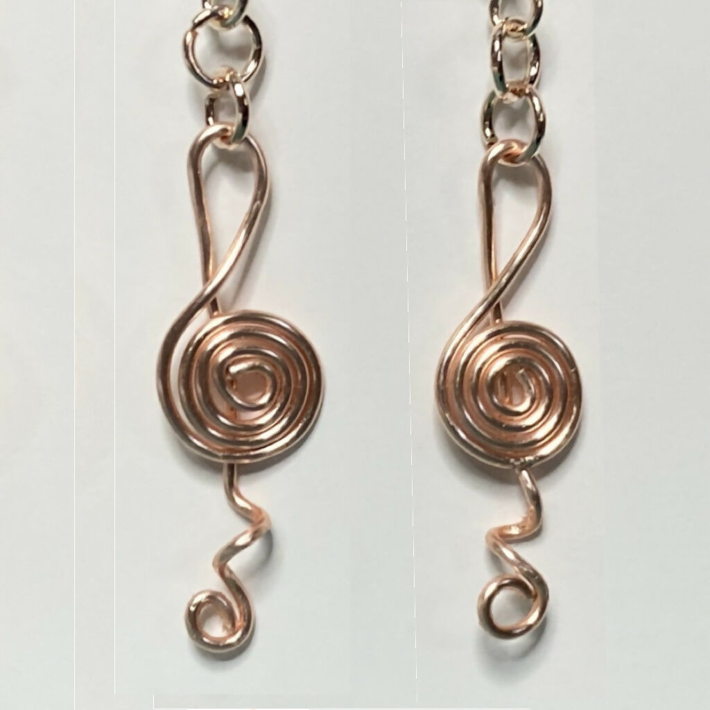 Treble clef spiral wire dangle earrings in rose gold tone
