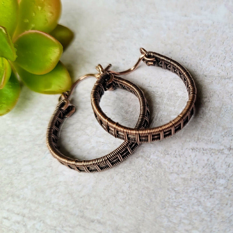 Woven copper hoops earrings