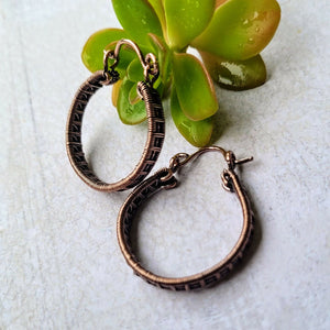 Woven copper hoops earrings