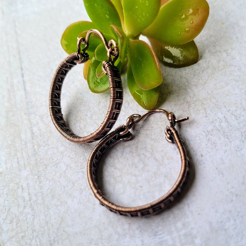 Woven copper hoops earrings