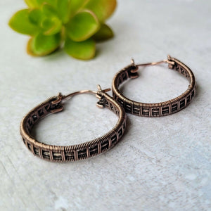 Woven copper hoops earrings