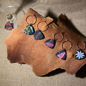 Set of 6 handmade polymer clay wine glass charms detailed with Australian native flowers. Inspired by nature.