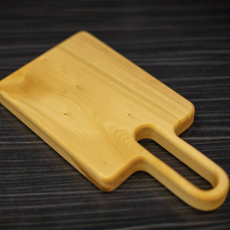 Tasmanian Huon Pine Serving/Chopping Board with an easy to hold long handle.