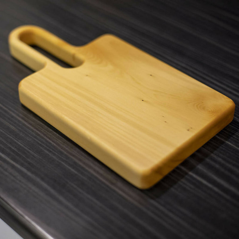 Tasmanian Huon Pine Serving/Chopping Board with an easy to hold long handle.
