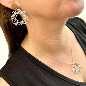 go-do-good-orbit-stud-earrings-and-pendant-on-model