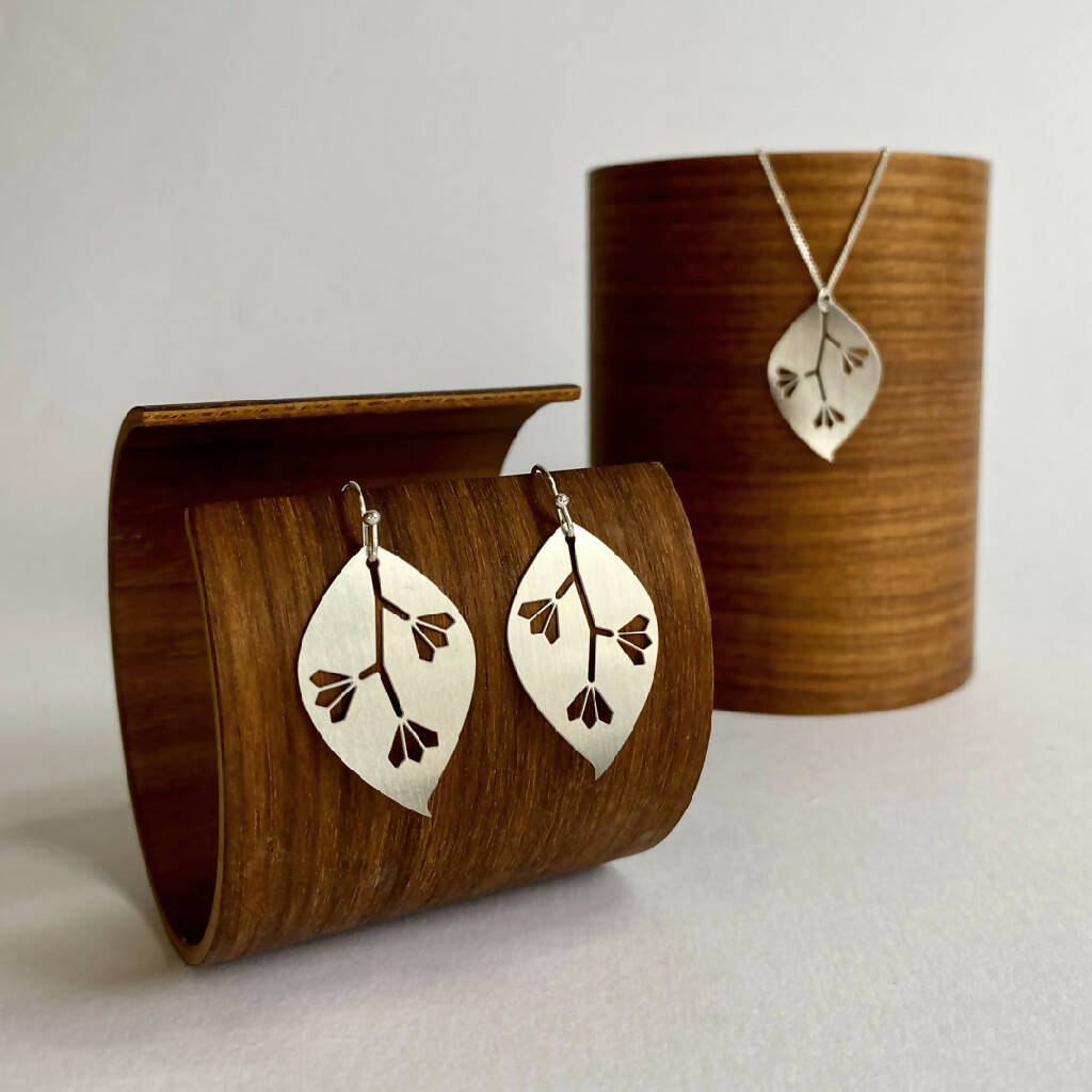 go-do-good-gum-leaf-earrings-and-pendant-necklace-on-wood