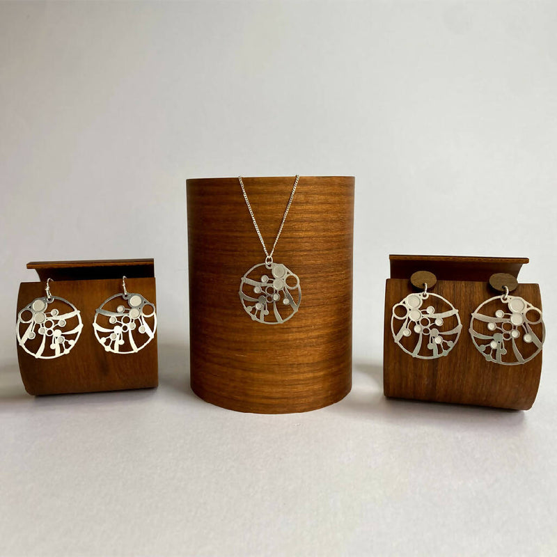 go-do-good-wattle-earrings-and-pendant-family-on-wood