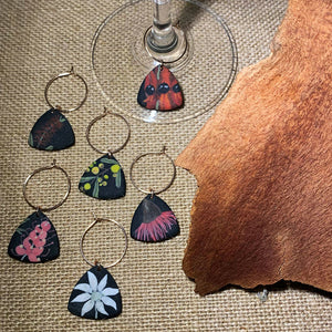Set of 6 handmade polymer clay wine glass charms detailed with Australian native flowers. Inspired by nature.
