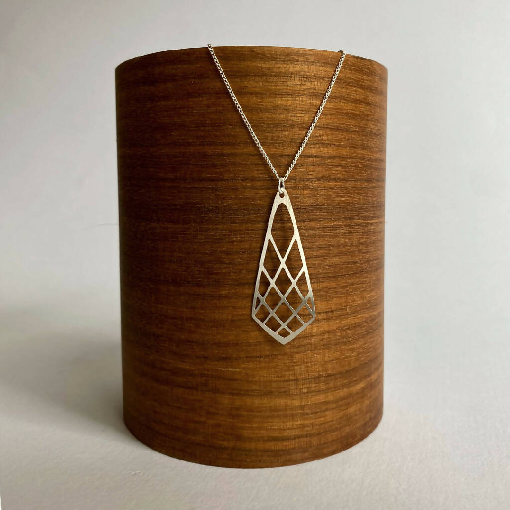 go-do-good-protea-bud--pendant-necklace-on-wood